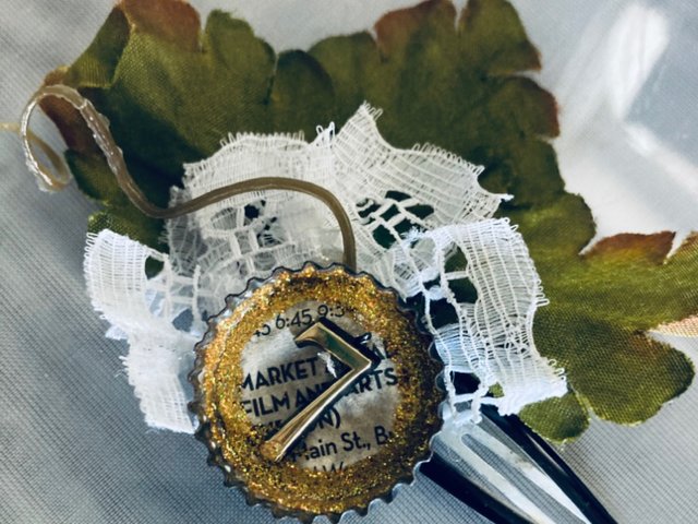 Handmade Victorian Inspired Hair Clip with White Lace, Green Leaves, and Newsprint Button with the Number Seven